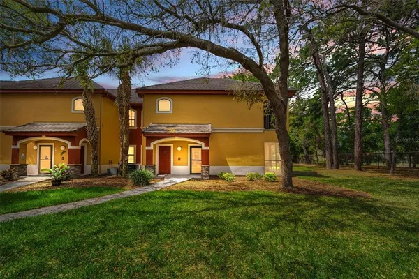 a view of a yard in front of a house