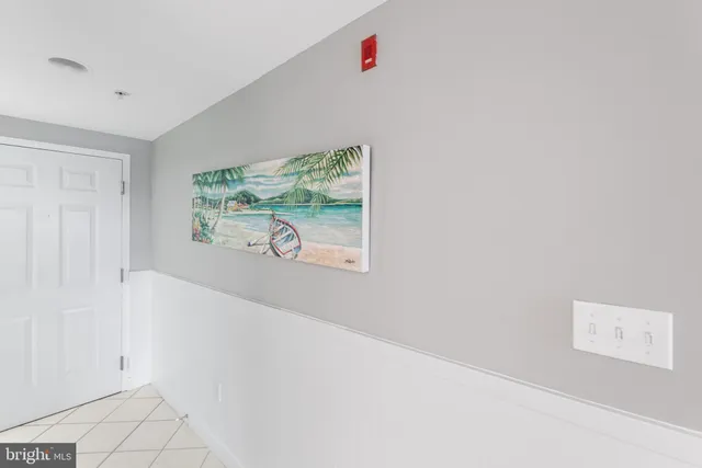 a view of entryway with window and wooden floor