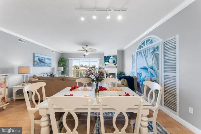 a living room with kitchen island granite countertop furniture and a large window