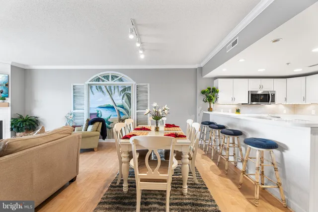 a view of a dining room with furniture and window