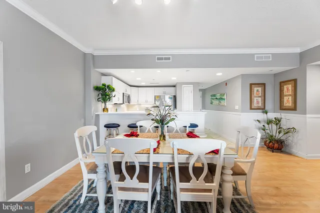 a living room with furniture a lamp and a rug