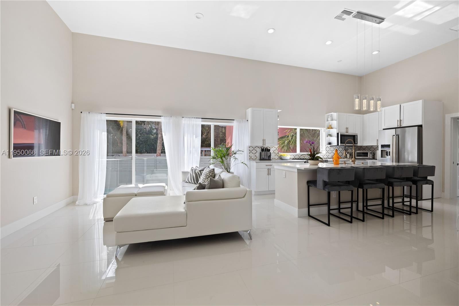 12 Adams Road Ocean Ridge, FL 33435 - Photo 19 of 24 12 Adams living room kitchen