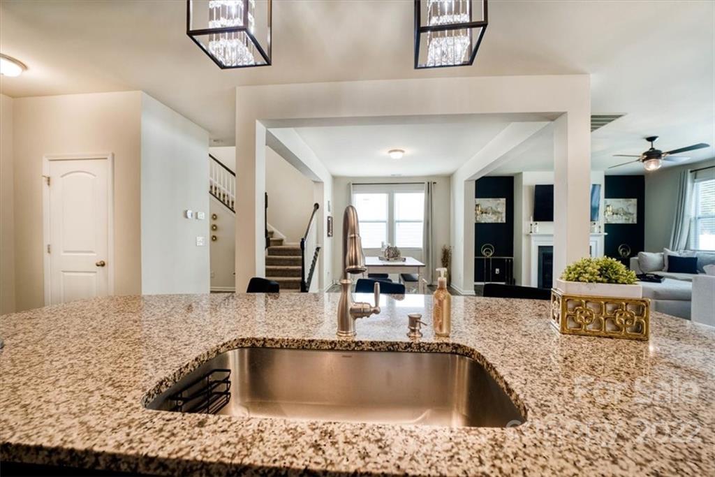 14015 Ridgewater Way Charlotte, NC 28278 - Photo 11 of 48 a bathroom with a granite countertop sink and bathtub