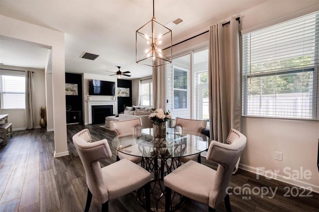 14015 Ridgewater Way Charlotte, NC 28278 - Photo 13 of 48 a view of a dining room with furniture window and wooden floor