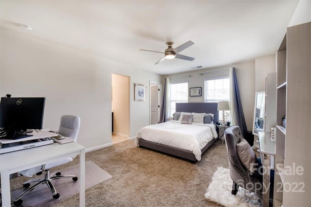 14015 Ridgewater Way Charlotte, NC 28278 - Photo 21 of 48 a bedroom with a bed a desk and chair