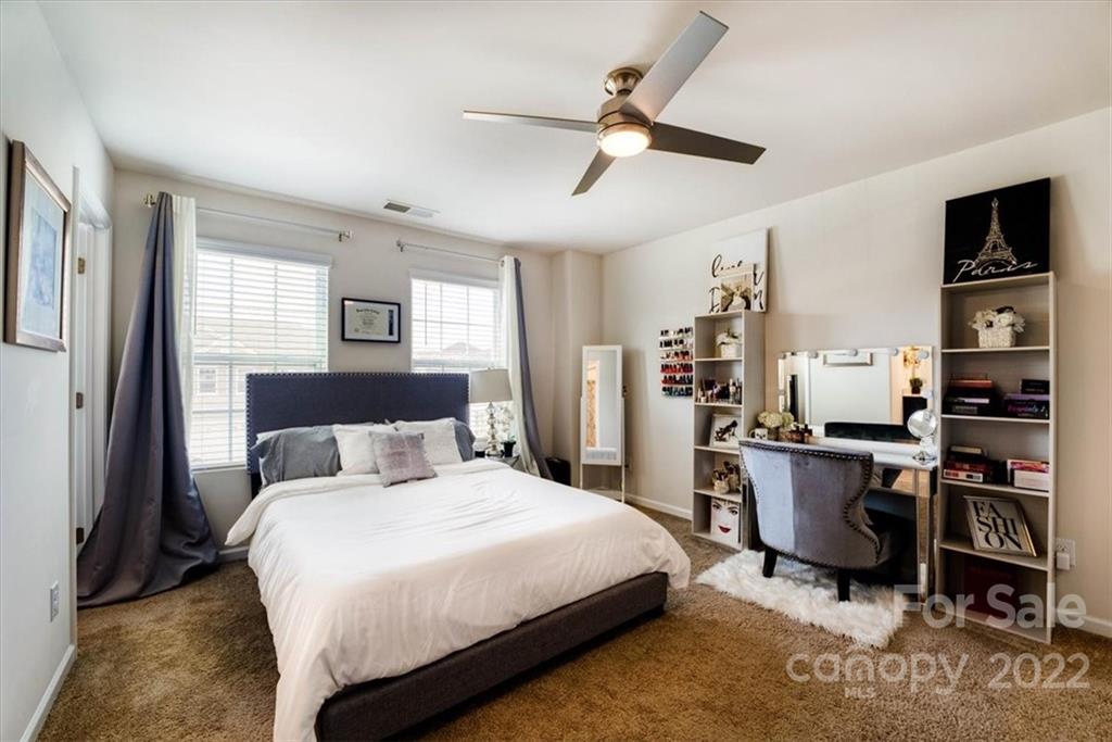 14015 Ridgewater Way Charlotte, NC 28278 - Photo 23 of 48 a bedroom with a bed a desk and chair