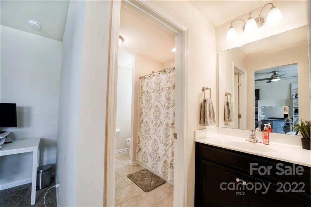 14015 Ridgewater Way Charlotte, NC 28278 - Photo 24 of 48 a bathroom with a sink vanity and a mirror