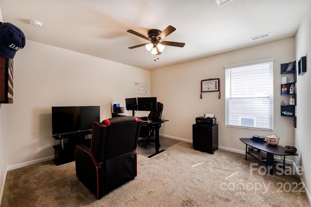 14015 Ridgewater Way Charlotte, NC 28278 - Photo 28 of 48 a living room with furniture and a flat screen tv