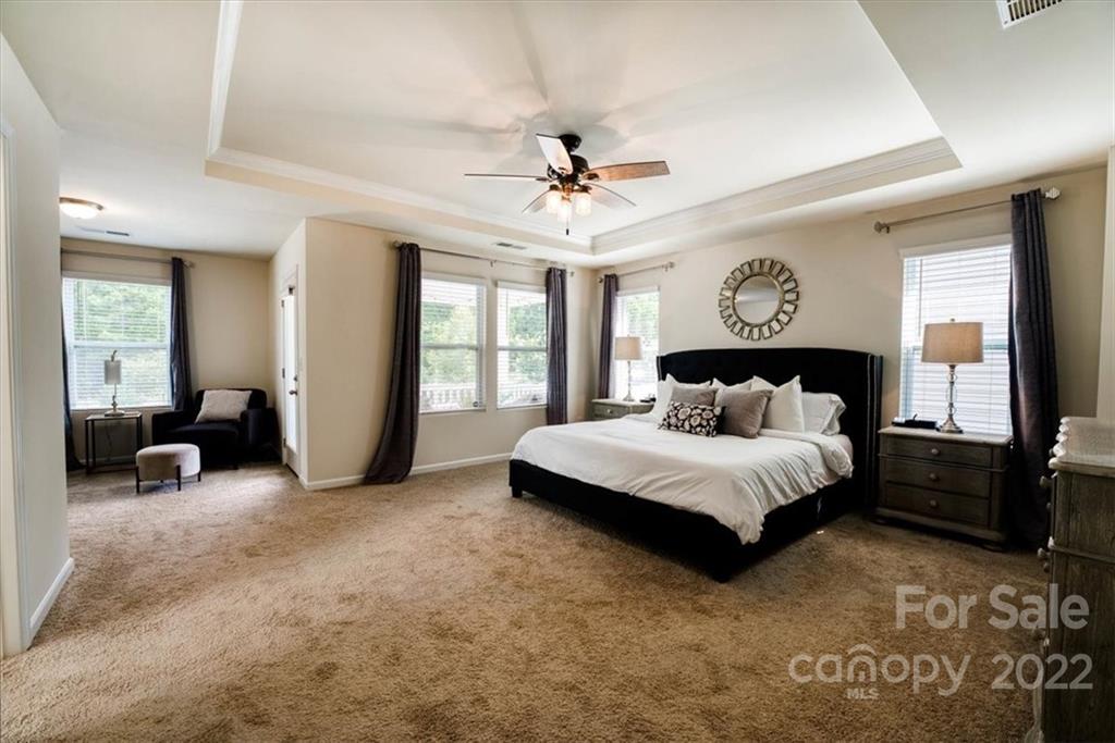 14015 Ridgewater Way Charlotte, NC 28278 - Photo 31 of 48 a spacious bedroom with a bed and a large window