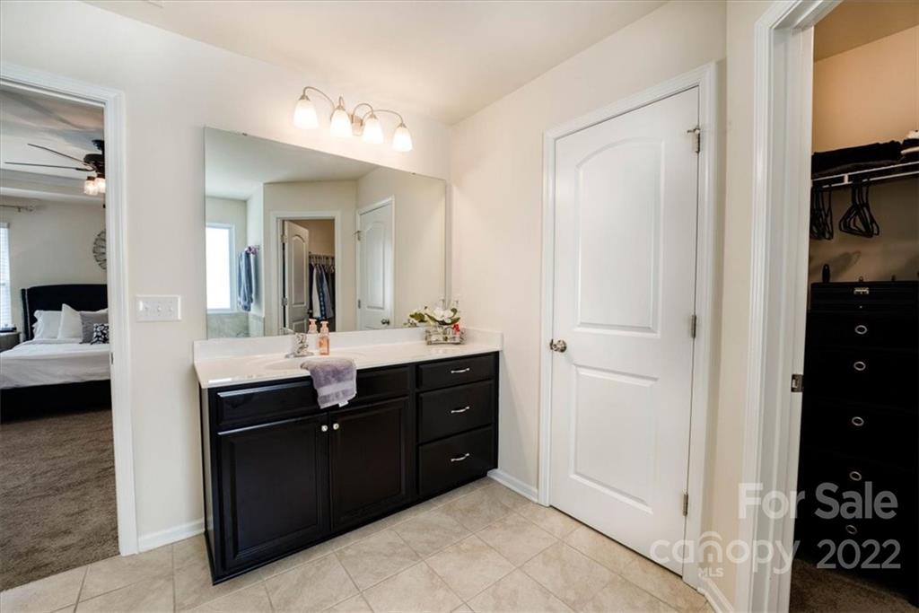 14015 Ridgewater Way Charlotte, NC 28278 - Photo 37 of 48 a bathroom with a double vanity sink and a mirror