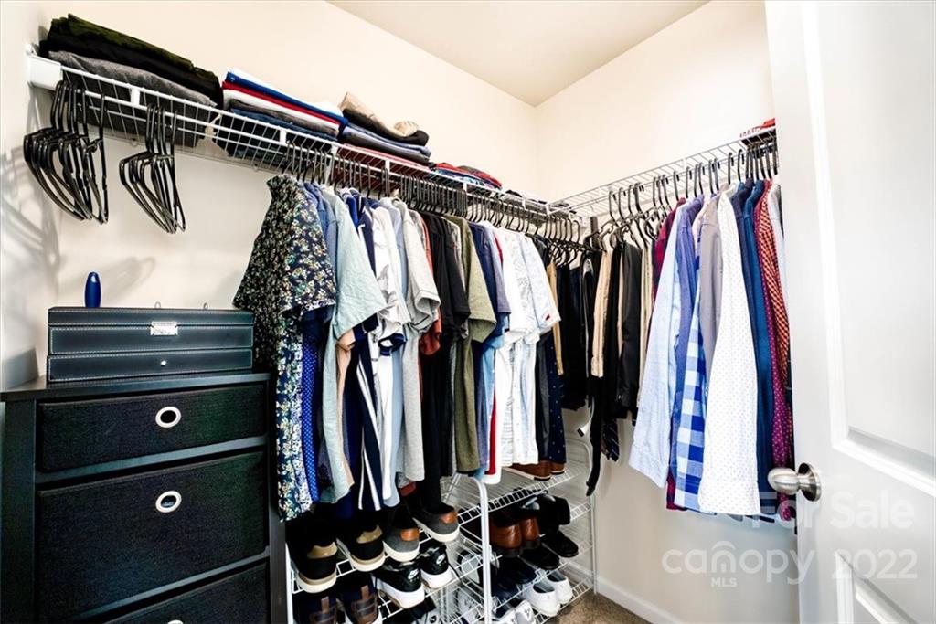 14015 Ridgewater Way Charlotte, NC 28278 - Photo 38 of 48 a view of walk in closet with clothes and shoes