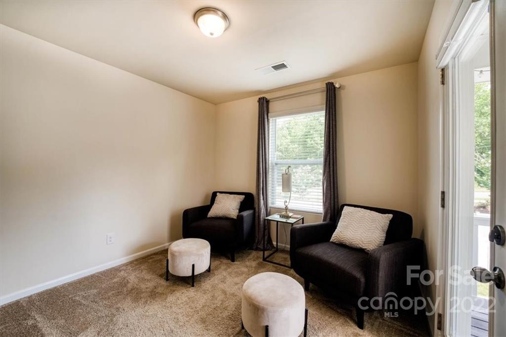 14015 Ridgewater Way Charlotte, NC 28278 - Photo 39 of 48 a room with furniture and a window
