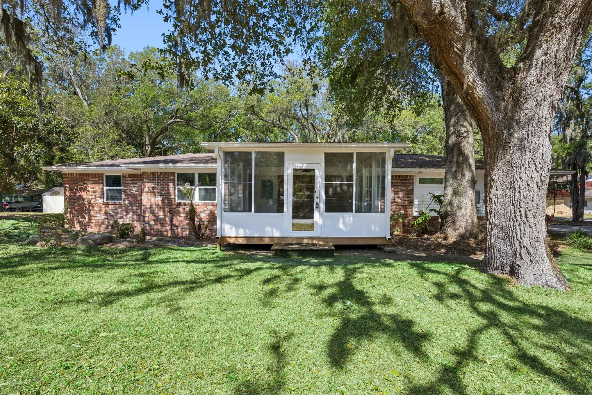 2441 Amelia Road Fernandina Beach, FL 32034 - Photo 15 of 36 a view of a house with a yard