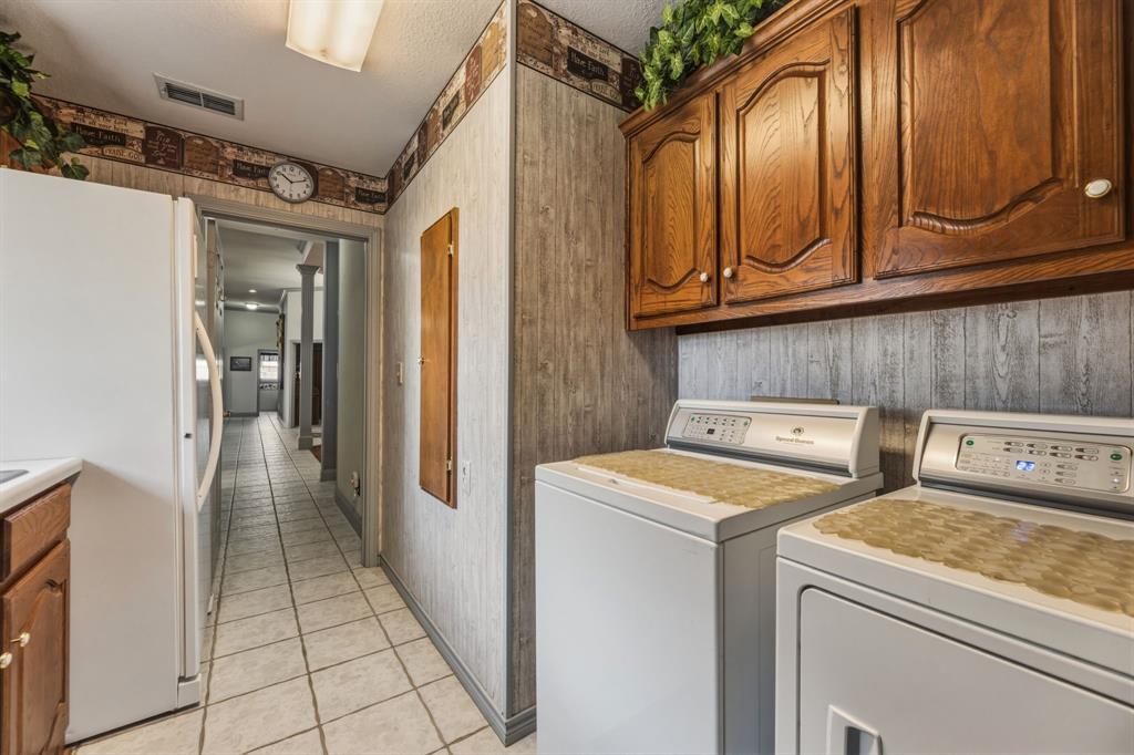 130 Blazek Road Alma, TX 75119 - Photo 25 of 34 a utility room with dryer and washer