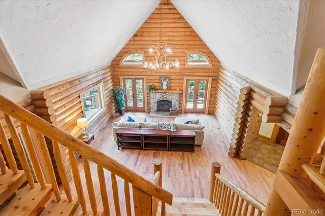 a living room with a bed and a window
