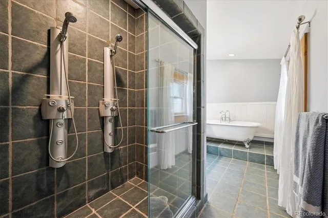 a bathroom with a shower and a sink