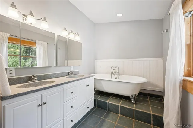 a bathroom with a sink and a window