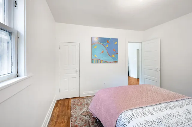 a bedroom with bed and window