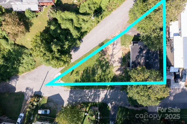 a swimming pool with outdoor seating and trees