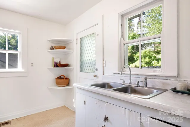 a kitchen with a sink and a window