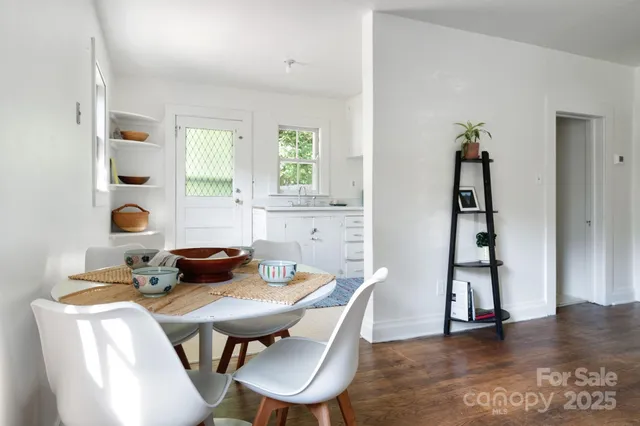 a view of a dining room with furniture and window