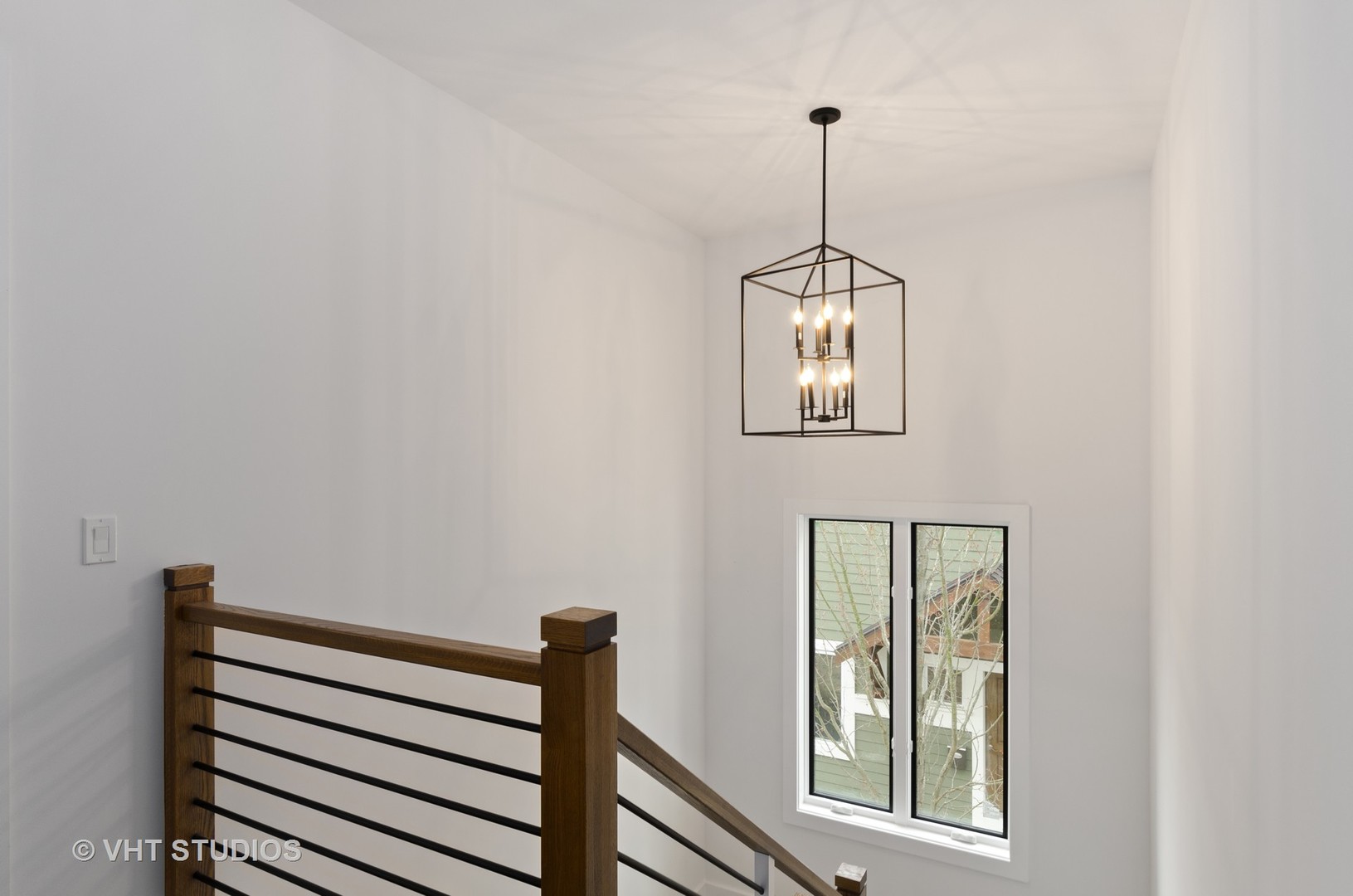 717 Meadow Lane Libertyville, IL 60048 - Photo 12 of 23 a view of a hallway with windows and white walls