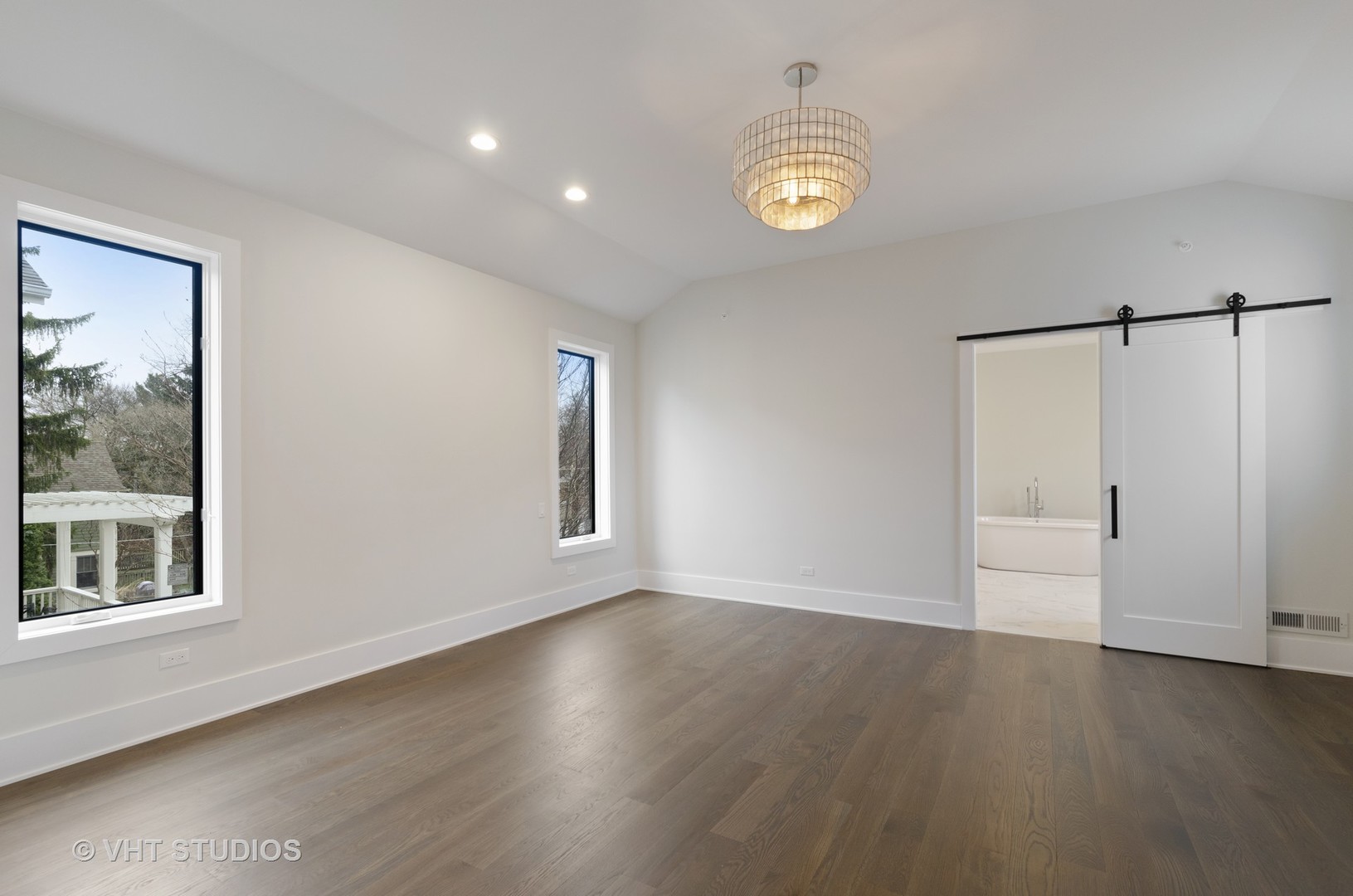 717 Meadow Lane Libertyville, IL 60048 - Photo 13 of 23 an empty room with wooden floor and windows
