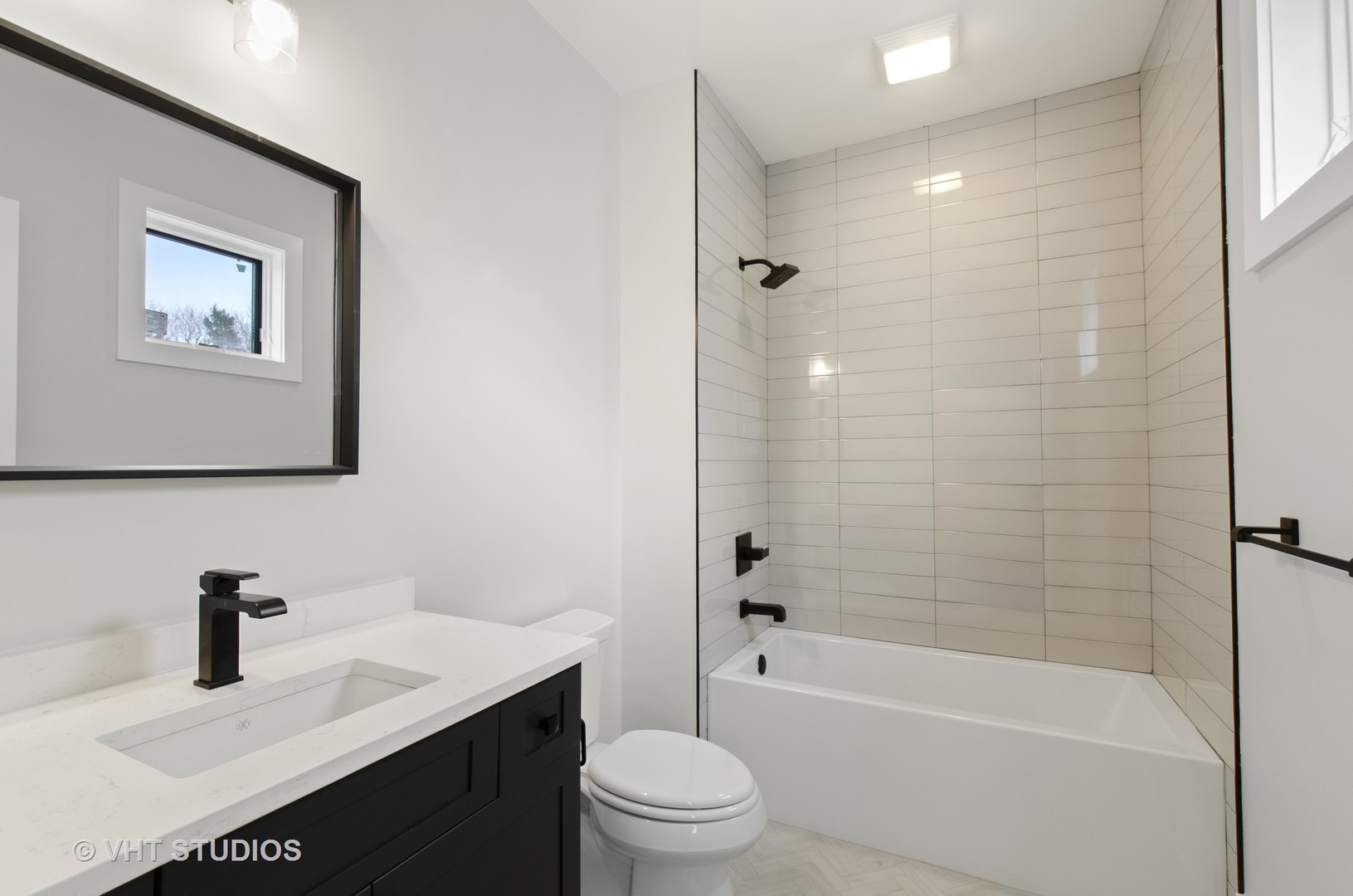 717 Meadow Lane Libertyville, IL 60048 - Photo 18 of 23 a bathroom with a sink a toilet and shower