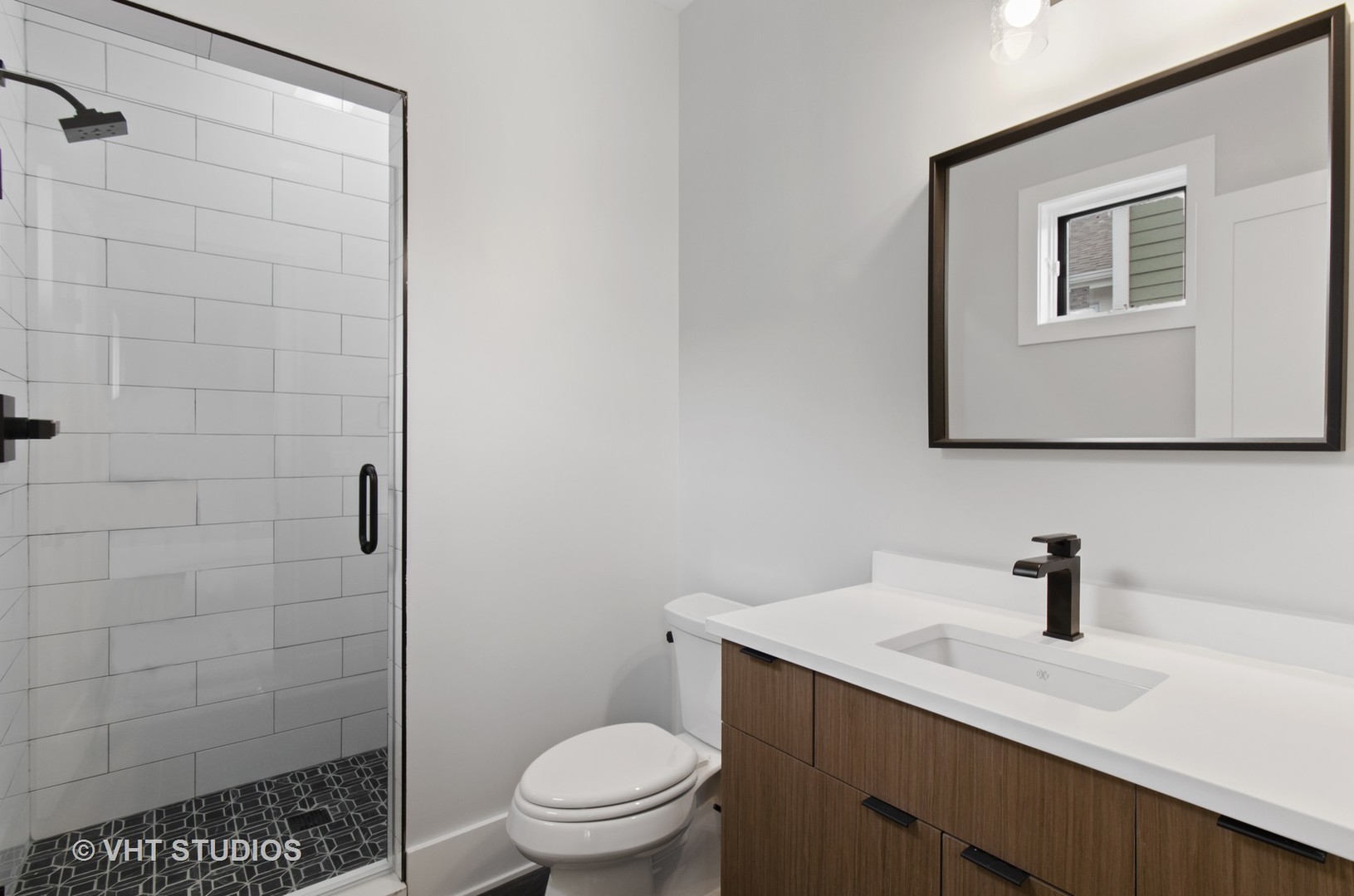 717 Meadow Lane Libertyville, IL 60048 - Photo 19 of 23 a bathroom with a sink a toilet and shower