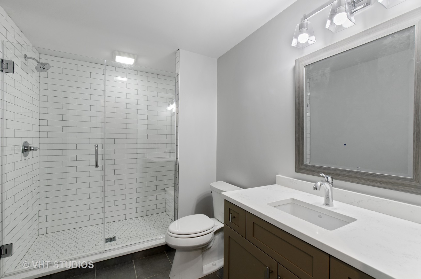 717 Meadow Lane Libertyville, IL 60048 - Photo 22 of 23 a bathroom with a sink a toilet and shower
