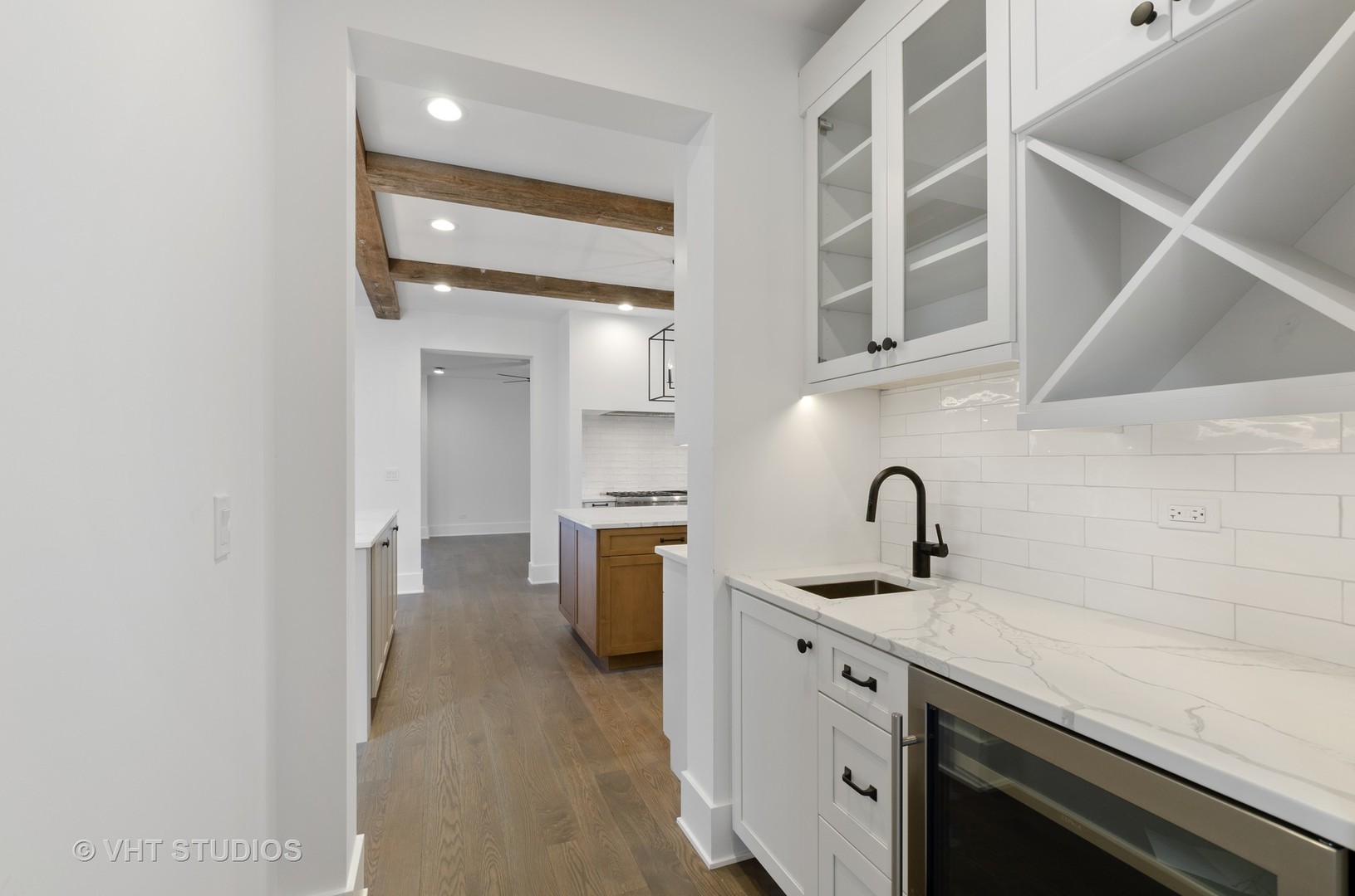 717 Meadow Lane Libertyville, IL 60048 - Photo 6 of 23 a kitchen with a sink and a refrigerator