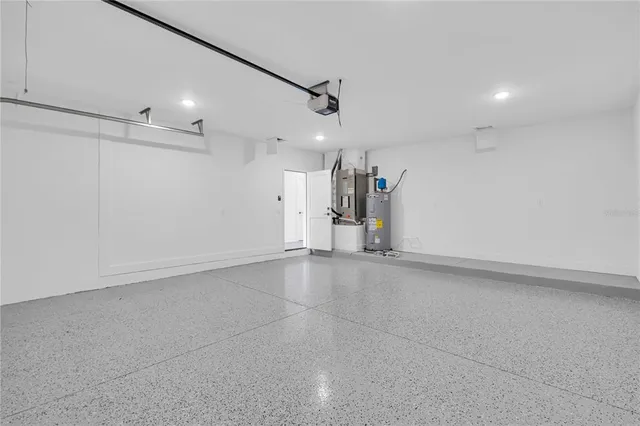 an empty room with a empty space and windows