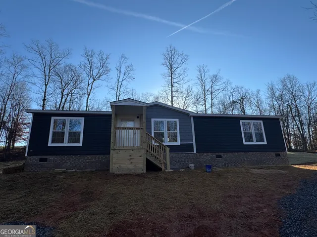 a house view with a backyard space