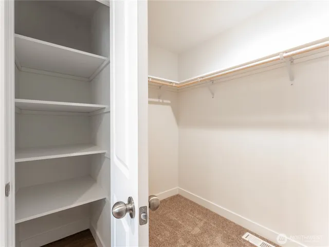 a view of an empty walk in closet