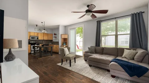 a living room with furniture and a large window