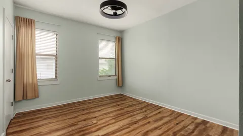 a work room with furniture and a window