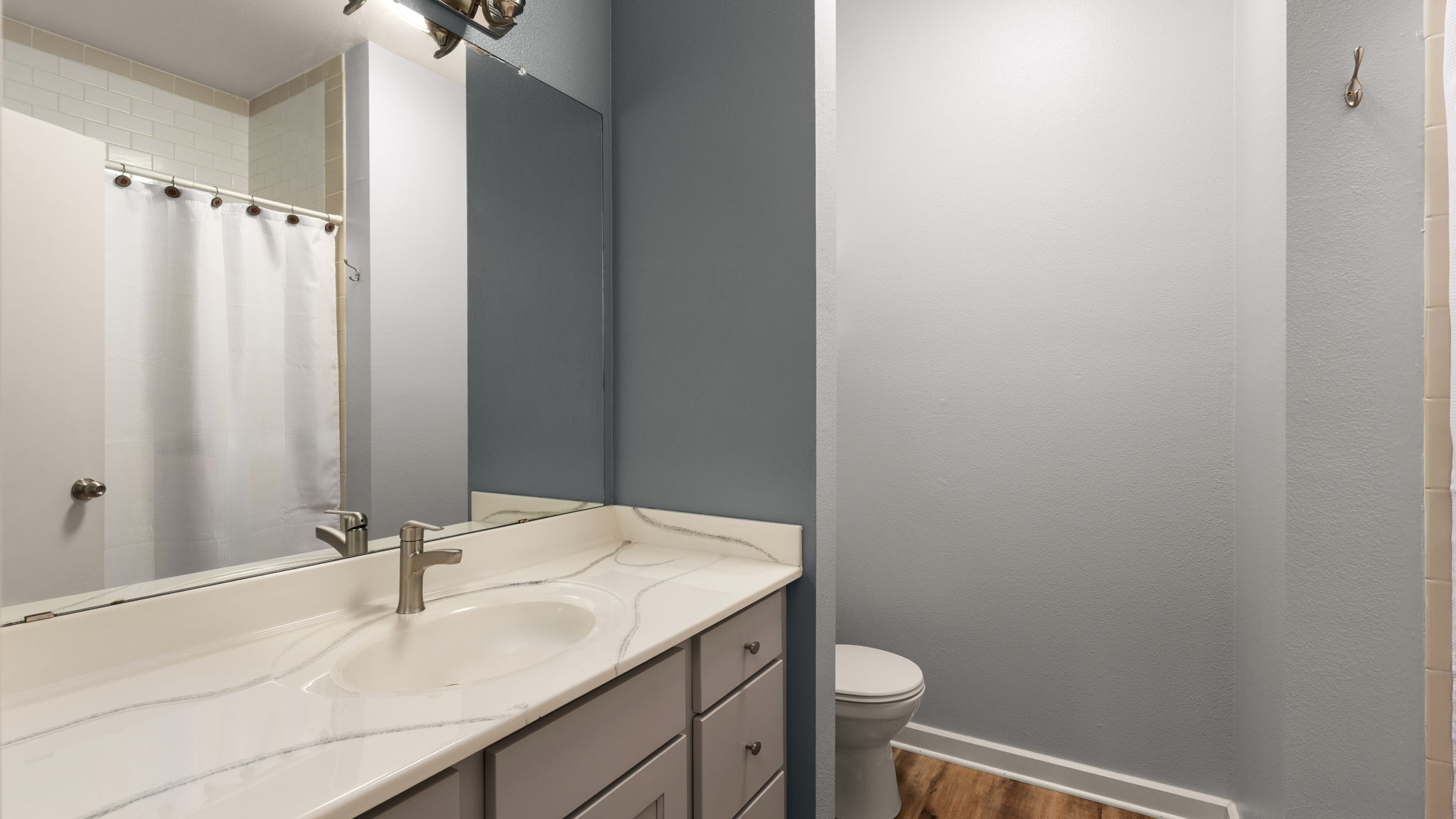 1201 Grove Boulevard, Unit 2802 Austin, TX 78741 - Photo 16 of 21 a bathroom with a sink and a mirror
