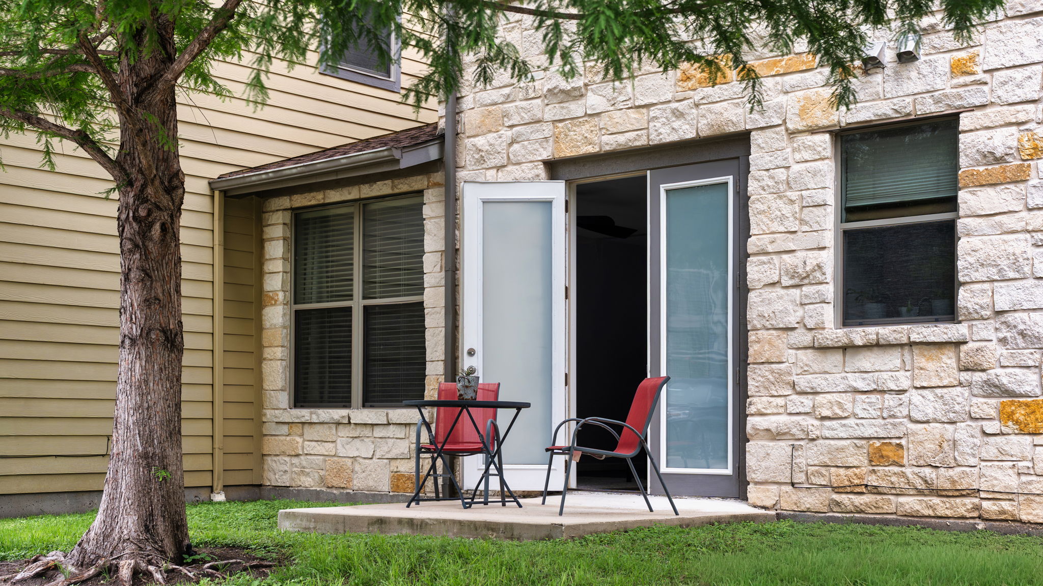 1201 Grove Boulevard, Unit 2802 Austin, TX 78741 - Photo 9 of 21 a couple of chairs in front of house