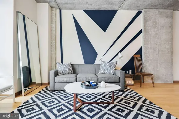 a living room with furniture and a rug
