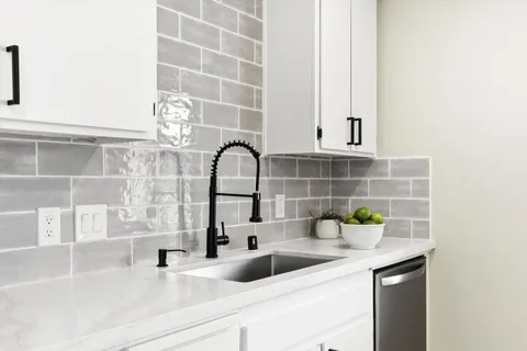 a kitchen with a sink and a window
