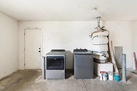 a kitchen with a stove and a chandelier