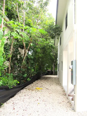 a view of a backyard of the house