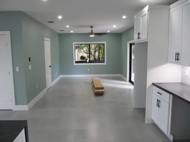a kitchen with stainless steel appliances a refrigerator and a sink