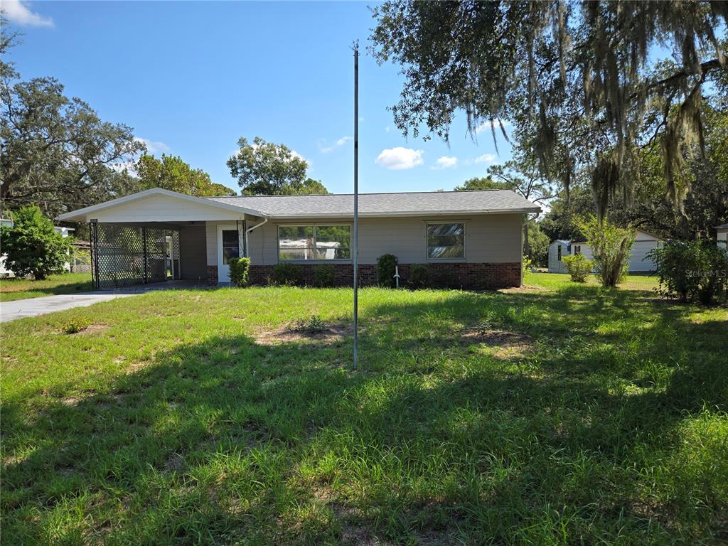 36904 Ridge Road Fruitland Park, FL 34731 - Photo 1 of 1 a view of a house with a yard and sitting area