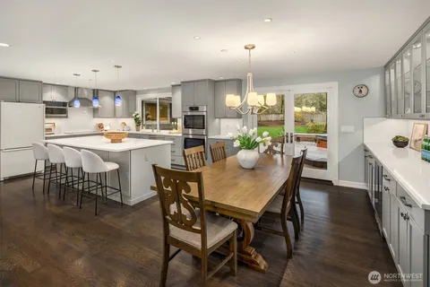 a kitchen with a table and chairs