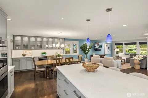 a large kitchen with a table and chairs