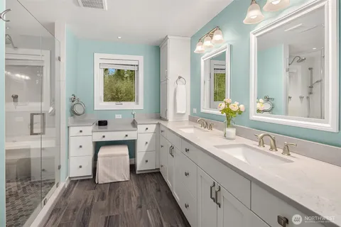a bathroom with a bathtub and shower