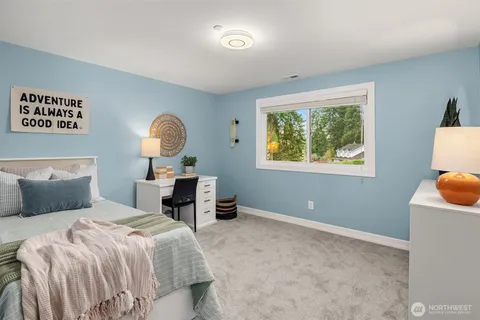 a bed room with a bed and a window
