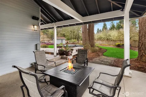 a view of a house with a yard porch and sitting area