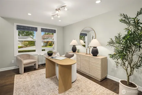 a living room with furniture a window and flowerpot